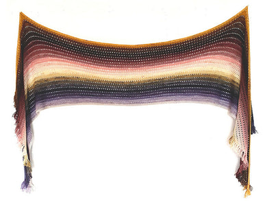 A knitted wrap with short fringe at the ends made from twenty five mini skeins arranged in gradient colour order from purples through greens to creams and pinks through browns to yellows hanging on a white background (Adventuring Wrap by Ambah O'Brien) Edit alt text