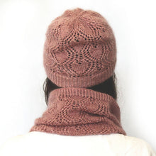 Load image into Gallery viewer, The back view of a young woman. She has long dark hair and a white shirt is wearing a dusky pink lacey beanie and cowl. The background is white.

