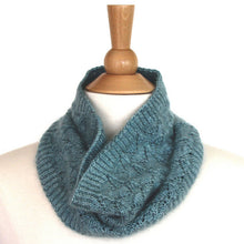 Load image into Gallery viewer, A pale blue-green fishtail lace cowl sits around the neck of a mannequin, standing against a white background.

