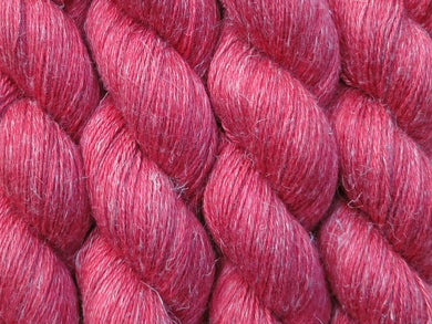 A close up of semi-solid red with hints of maroon and crimson coloured skeins of non-superwash baby alpaca, silk and linen 4ply fingering weight yarn (Japonica on Spinifex)