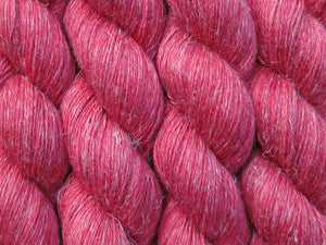 A close up of semi-solid red with hints of maroon and crimson coloured skeins of non-superwash baby alpaca, silk and linen 4ply fingering weight yarn (Japonica on Spinifex)