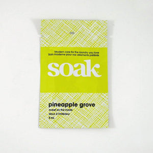 One bright yellow sachet of Soak rinse-free laundry liquid on a white background (Pineapple Grove)